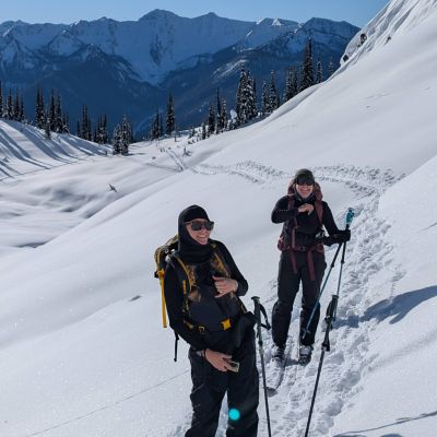 two women ski touring in the kootenays